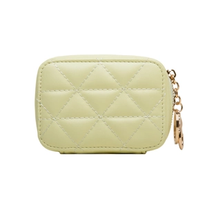 Pale yellow quilted PU leather makeup bag with gold zipper and keychain on white background