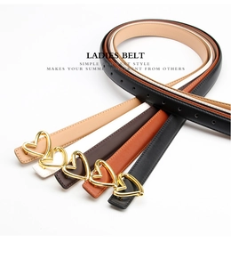 Close-up of slim leather belts with gold heart buckles in five colors for women