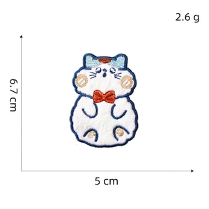 Cute white cat embroidery patch with blue outline and red bow on white background