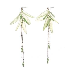 Acrylic leaf tassel earrings with green beads and silver pins on white background