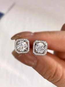 Close-up of square halo moissanite earrings in 925 sterling silver with sparkling stones
