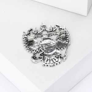 Macro view of the secure pin closure and vintage silver texture on the brooch back