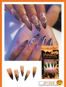 Long stiletto press on nails featuring Halloween moon and star patterns on dark gradient base