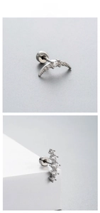 Macro shot of minimalist zircon ear studs with crescent and linear screw back designs