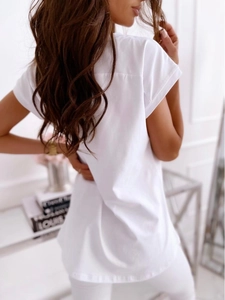 Detail view of the back seams and sleeve cuff craftsmanship of white cotton T-shirt