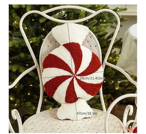 Detail of red and white spiral tufted candy cane pillow with size 11.41 by 18.5 inches