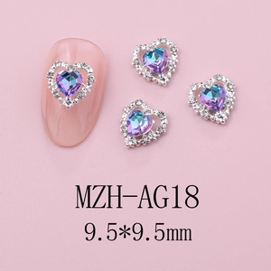 Macro detail of 9.5mm heart nail charm with purple crystal and small white rhinestones