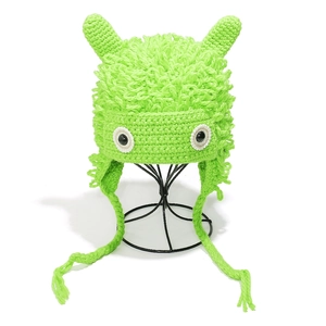 Handmade neon green crochet monster hat with horns and eyes for autumn and winter wear