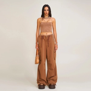 Brown knit crop top and wide-leg cargo pants set shown in a full-length model pose