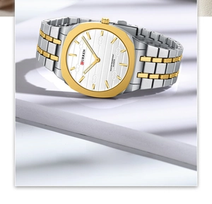 Detailed close-up of CURREN square watch with gold octagonal bezel and bicolor steel strap