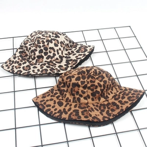 Women's suede leopard print bucket hats in light beige and dark camel colors