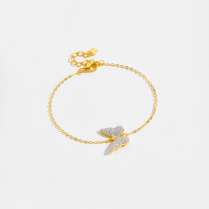 Detailed macro view of S925 silver butterfly charm bracelet with white pavé cubic zirconia