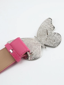 Detail of pink leather belt featuring a silver butterfly-shaped metal buckle with hammered texture