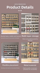 Detailed view of jewelry display rack with metal frames and solid wood base for earrings