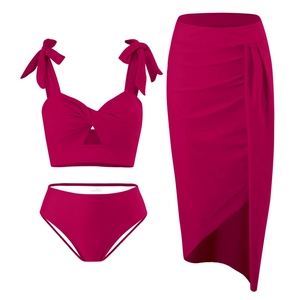 Three-piece rose red nylon bikini set with twist bow top, high waist bottom and wrap skirt