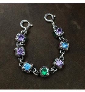 Detailed view of silver rainbow stone extension chain with square colorful gem links