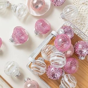 Pink and white Christmas ball set with sequins and stripes in a wooden basket display
