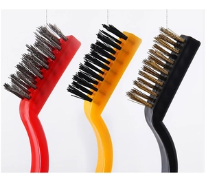 Macro shot of 3 kitchen gap brushes with steel, nylon, and brass bristles for deep cleaning