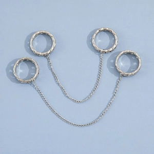 Silver punk style link chain rings set with woven texture on light blue background