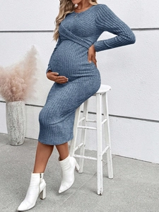Detail of greyish blue ribbed knit maternity dress showing fabric drape and side fit
