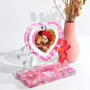 DIY heart photo frame resin mold with pink dried flowers and angel decorations