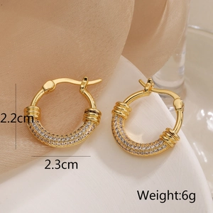 Detailed view of gold plated geometric earrings with zircon pavé and size measurements
