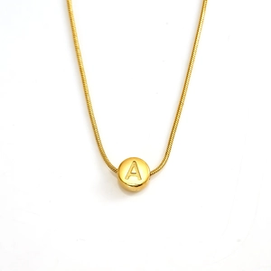 Gold stainless steel snake chain necklace featuring a round letter A alphabet pendant