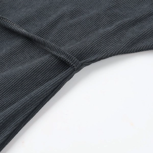 Macro shot of dark grey knit fabric texture and high-quality seam stitching details