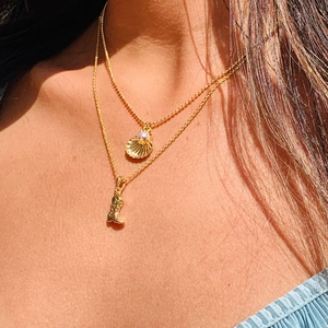 Golden double-layer necklace with shell pearl and western cowboy boot pendant charms