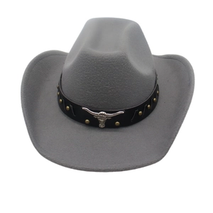 Detailed close-up of the grey wool felt cowboy hat with silver bull head metal ornament