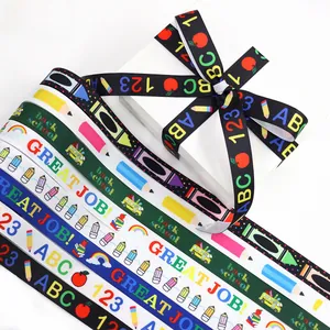 Detail of Back to School ribbons with colorful pencils, school buses and ABC prints