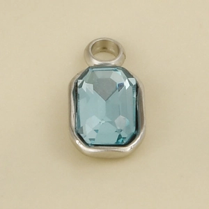 Close-up of a rectangular light blue faceted gemstone pendant in a silver steel setting
