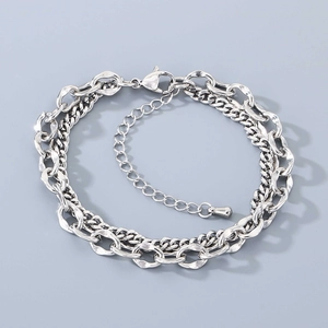 Detail of silver stainless steel double-layer chain bracelet with lobster clasp and extender