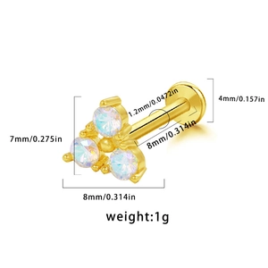 Detailed macro view showing dimensions of a 1.2mm golden lip stud with iridescent rhinestones