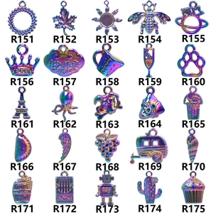 Macro display of 25 assorted colorful alloy charms with SKU codes on white background