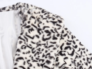 Close-up of leopard print faux fur texture and collar lining of the plush winter coat