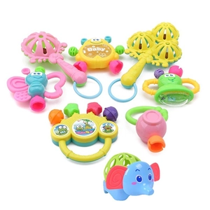 Flat lay of 7-piece colorful baby rattle and teether set for infant sensory development