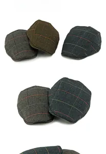 Detail of wool herringbone flat caps in various colors with classic British vintage textures