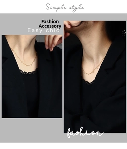 Detailed close-up of a minimalist gold-plated necklace with small beads worn on a model
