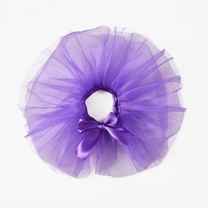 Detailed close-up of a purple tutu skirt for pets with a satin bow and mesh texture