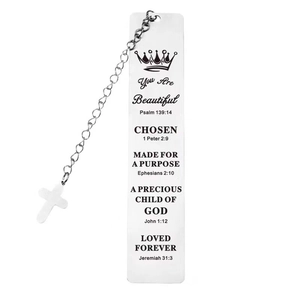 Detailed macro view of silver stainless steel bookmark with engraved Bible verses and cross