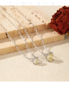 Macro detail of S925 sterling silver necklaces with yellow octagon cut rose diamonds