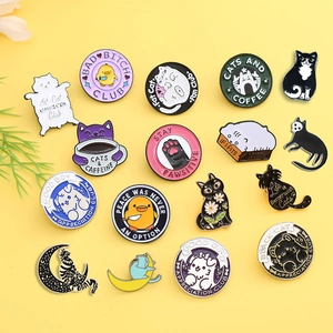 Cute assorted enamel animal pins with cat and dog designs on a bright yellow background