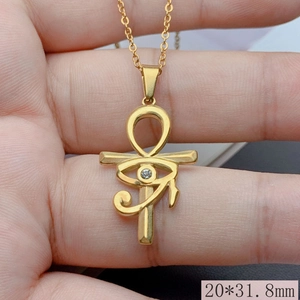 Detail shot of golden Eye of Horus pendant with zircon and 20*31.8mm size specs