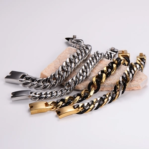 Heavy industrial punk cuban link bracelets in silver and gold-black steel on stone base