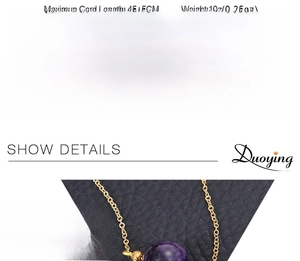 Macro shot of 16mm amethyst pendant necklace with fine gold chain on black leather background