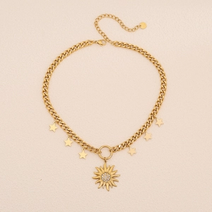 Gold star and sun pendant necklace with cubic zirconia on a minimalist cuban link chain