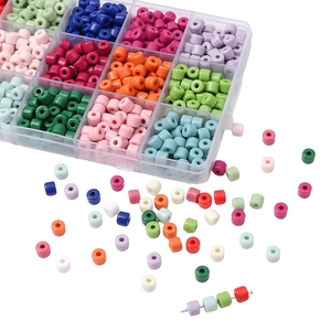 Colorful acrylic cylindrical macaron beads set with clear plastic organizer box