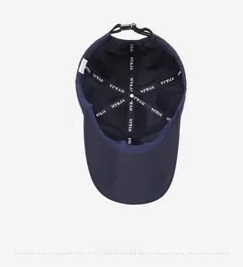 Detailed interior of navy blue baseball cap showing inner seams and branded tapes