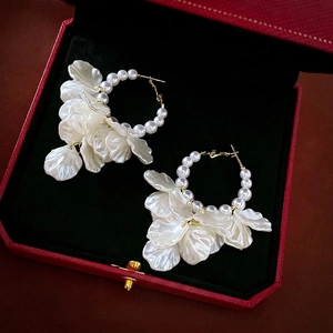 Elegant French style pearl flower hoop earrings with gold finish on black jewelry box